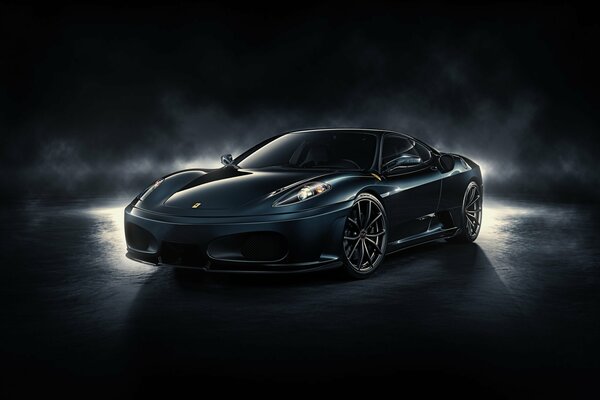 The Ferrari f430 car stands on a dark background at midnight