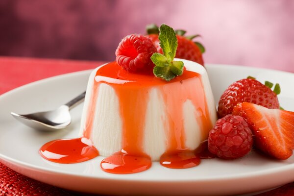 A plate with cottage cheese dessert and berries