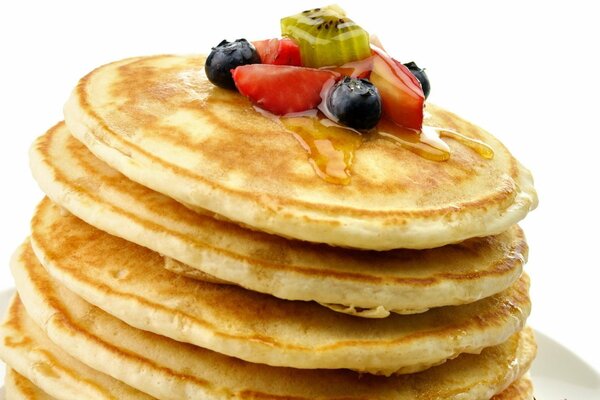 Pancakes with fruits, berries and honey