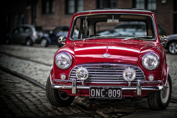 Red mini-cooper on the old road