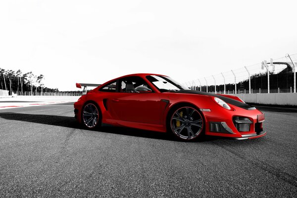 Red Porsche 911 GT2 RS on black and white background