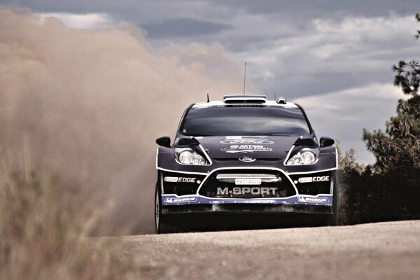 Front view of a sports car participating in summer races