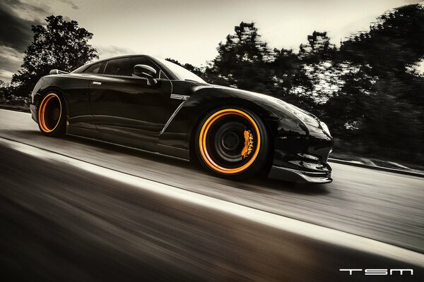 Black Nissan gtr with yellow discs