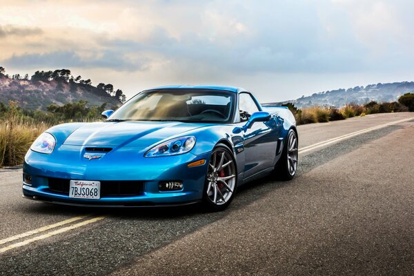 Chevrolet corvette z 06, a racing car on the road