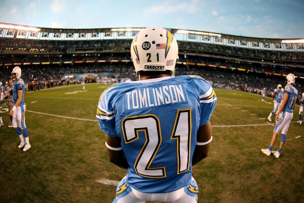 American football in a full stadium