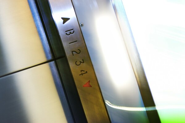 Engraved numbers on the metal structure of the elevator