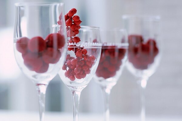 Glasses with berries with a blurred focus