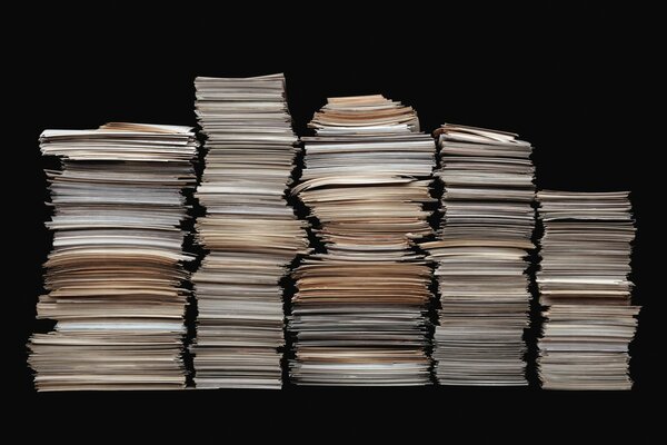 A mountain of leaflets neatly stacked in a pile