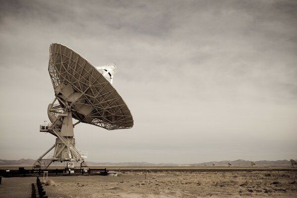 Huge satellite dish on the sky background