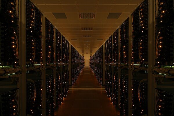 Unusual night corridor - data center with flashing lights on servers