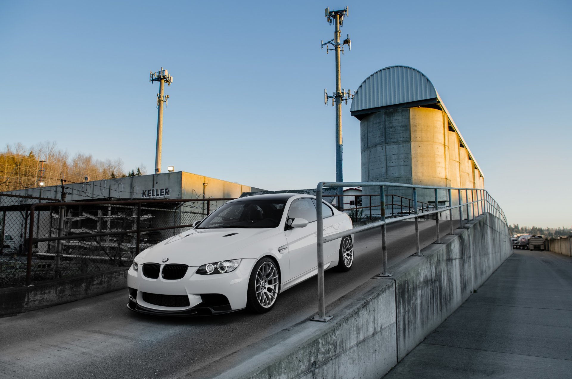 bmw m3 e92 white bmw coupe exit fence sky