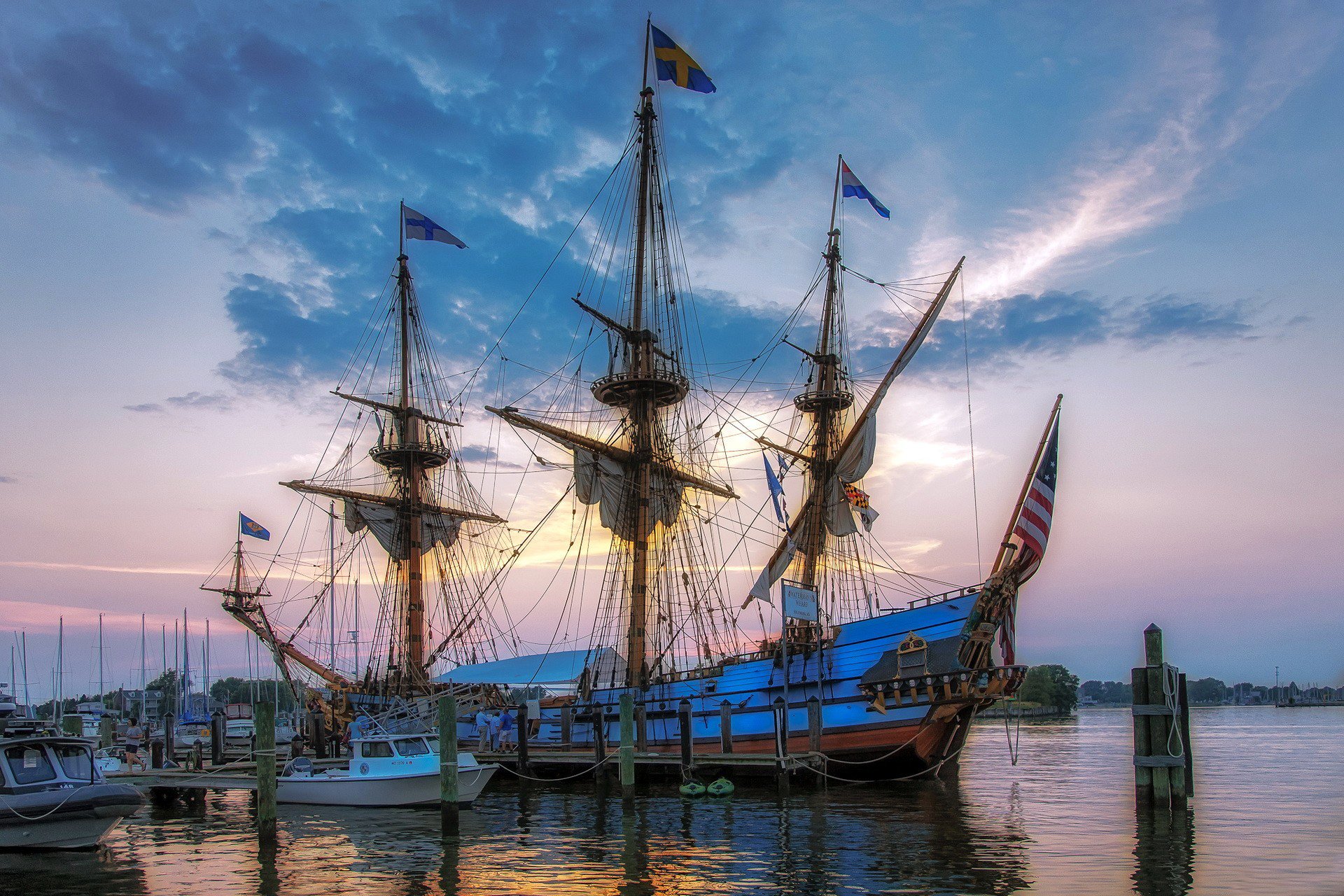 pier pier ship masts sails ropes flags sky cloud