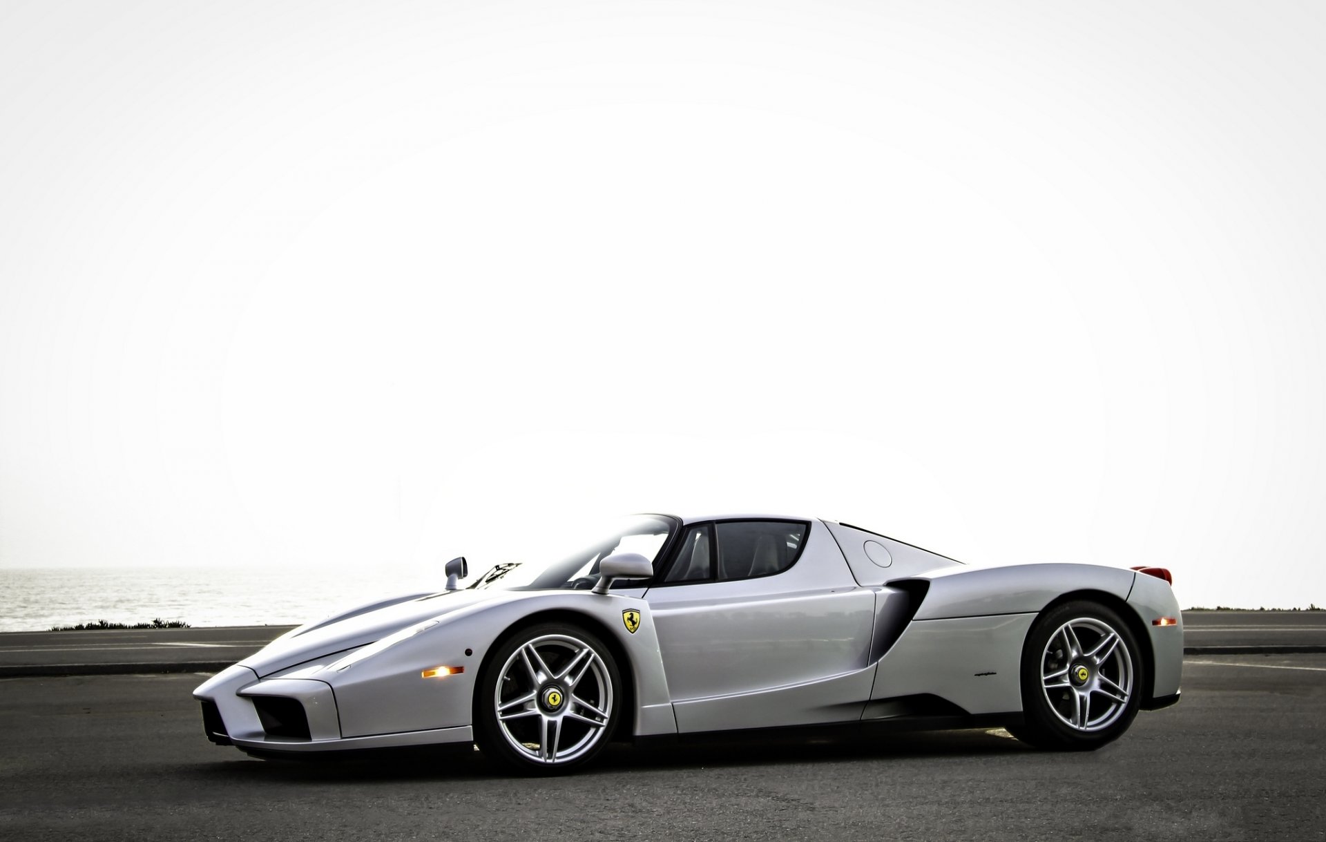 ferrari enzo silver ferrari side view silver sky sea