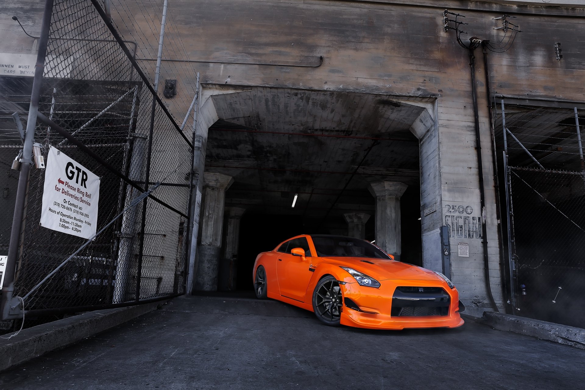 nissan gt-r r35 orange nissan front view building gate