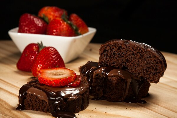 Sweet chocolate cupcakes with strawberries