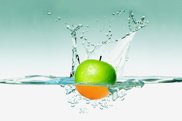 Water splashes from a fallen apple