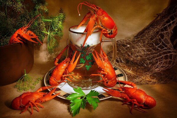 Red crayfish around a beer mug