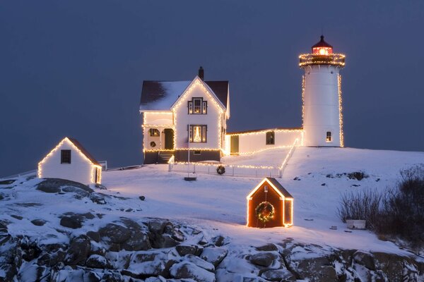 Beautifully illuminated lighthouse on Christmas night