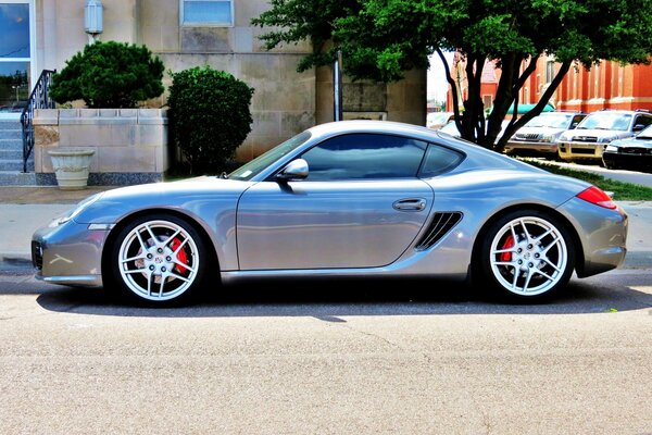 Porsche Cayman sports car on a city street