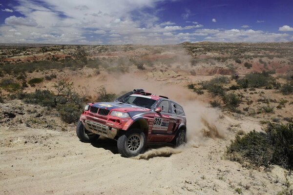 Jeep competition in the desert. Sand from under the wheels