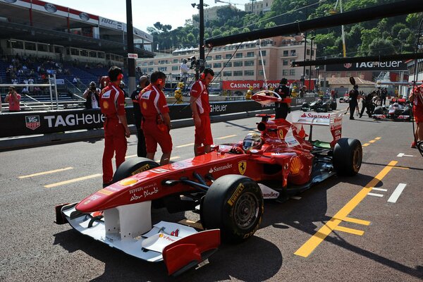 Fernando Alonso in a red Ferrari