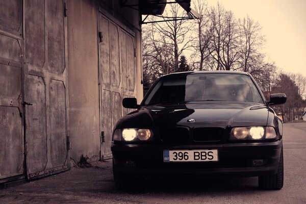 Black bmw at the garage arrays in front