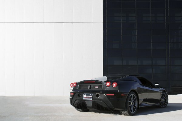 Rear view of a black Ferrari car