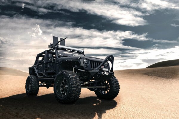 Jeep wrangler black moving through the desert