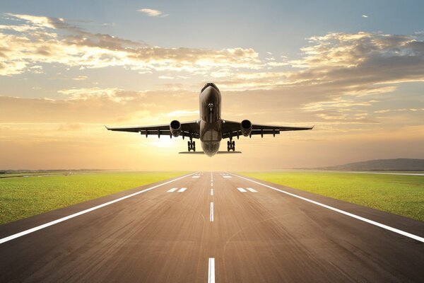 The plane takes off against the background of a sunny sky