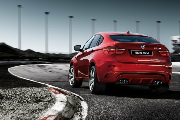 Red bmw x6 jeep on asphalt