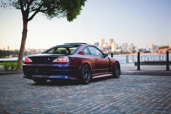 Nissan Silvia s15 on the background of the city