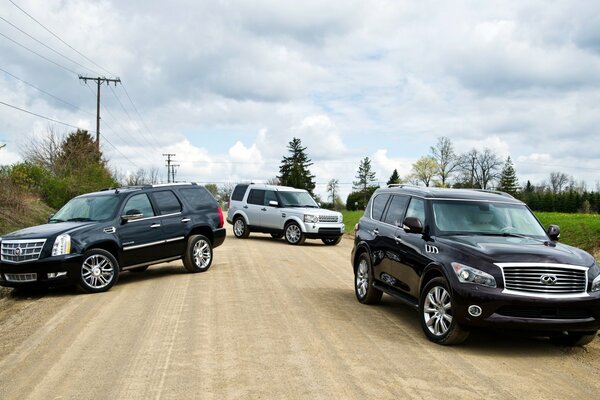 Three SUVs photos in nature