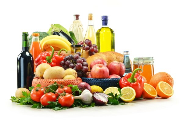 Fruits and vegetables in baskets next to butter