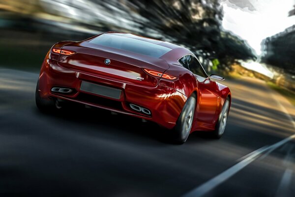 A beautiful red car is driving on the road