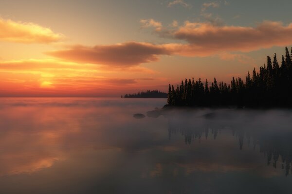 Coucher de soleil brumeux sur le lac