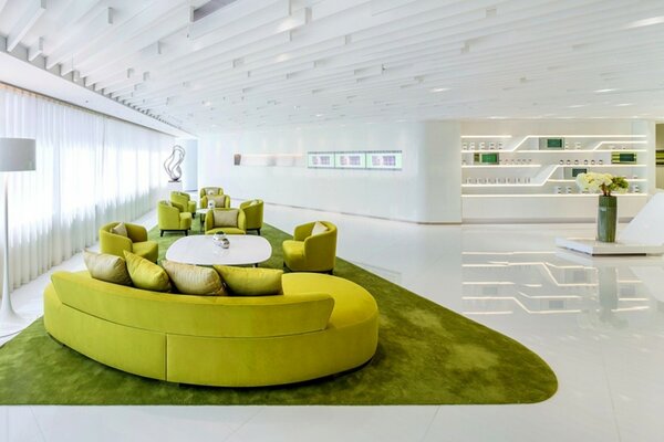 The living room is made in a white and green style