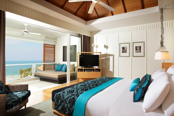 Bedroom with a view of the blue sea