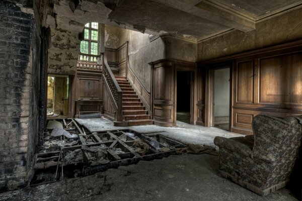 A ruined house with a staircase