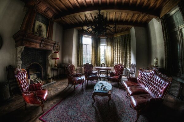 Classic interior. Leather furniture and fireplace in the room