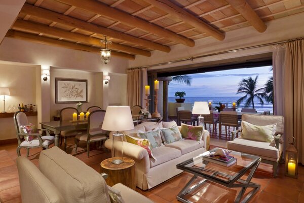 A suite in a hotel with a panoramic view of the palm trees