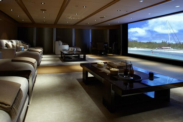 Modern cinema with sofas and pillows