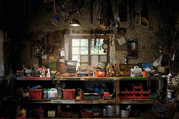 Workshop with tools on a shelf by the window