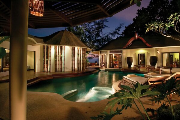 Swimming pool at ocean villa at night