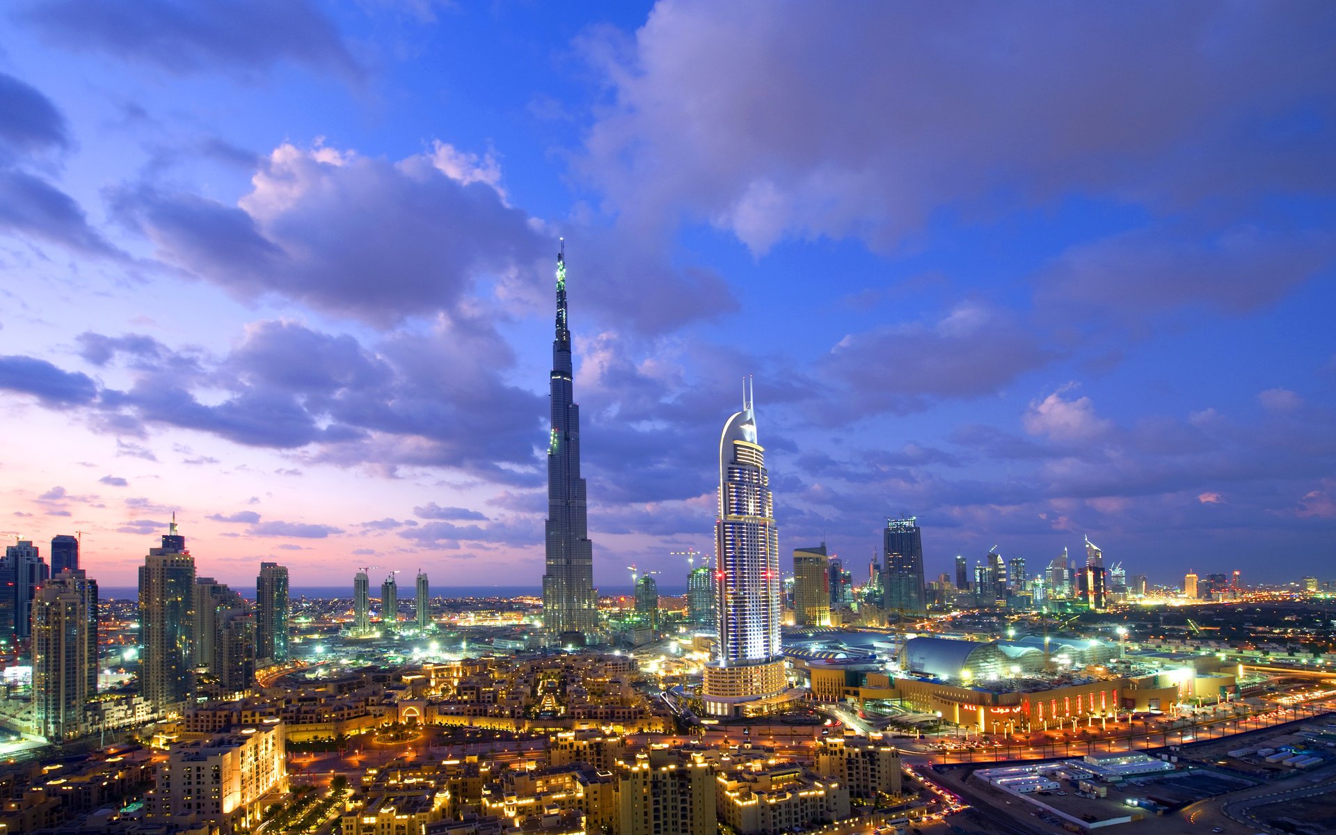 night the city lights the sky clouds skyscrapers dubai