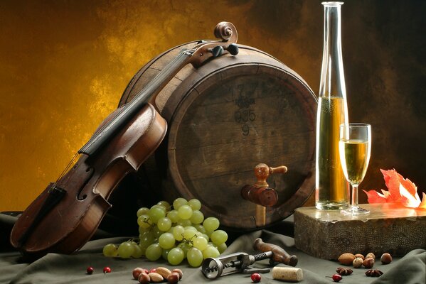 A barrel of grapes and a bottle on a brown background