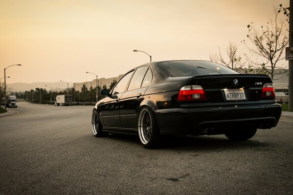 BMW rear view on the road with lights