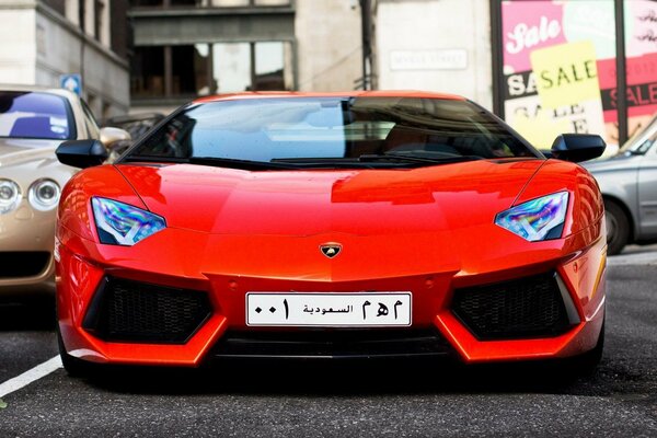 Auto Lamborghini orange mit arabischen Zahlen