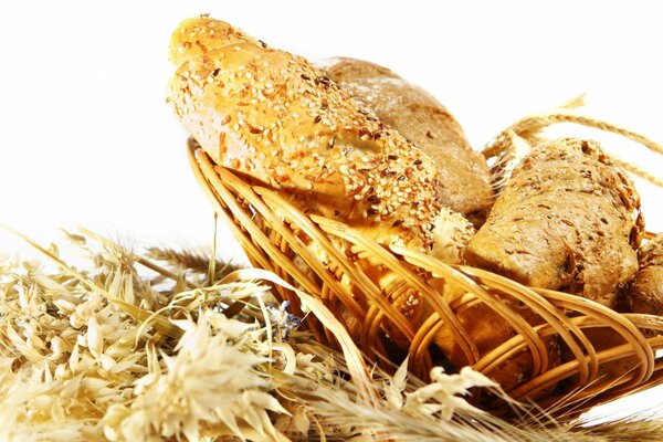 Sesame bread in a basket on a white background