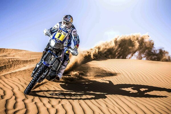 Dakar motorcycle racer on the sand