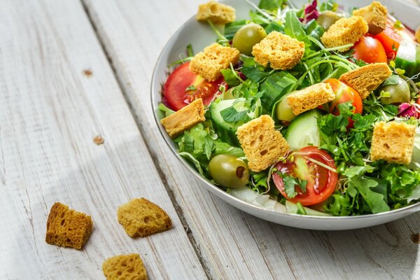 Vegetable salad on a platter with croutons